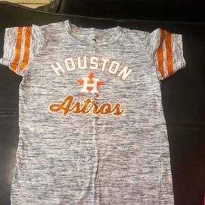 Girls Houstin Astros shirt and navy blue sports shorts.
